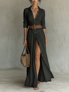 Rear view of the black Seraphina linen blend maxi dress, emphasizing the drape and length of the garment.