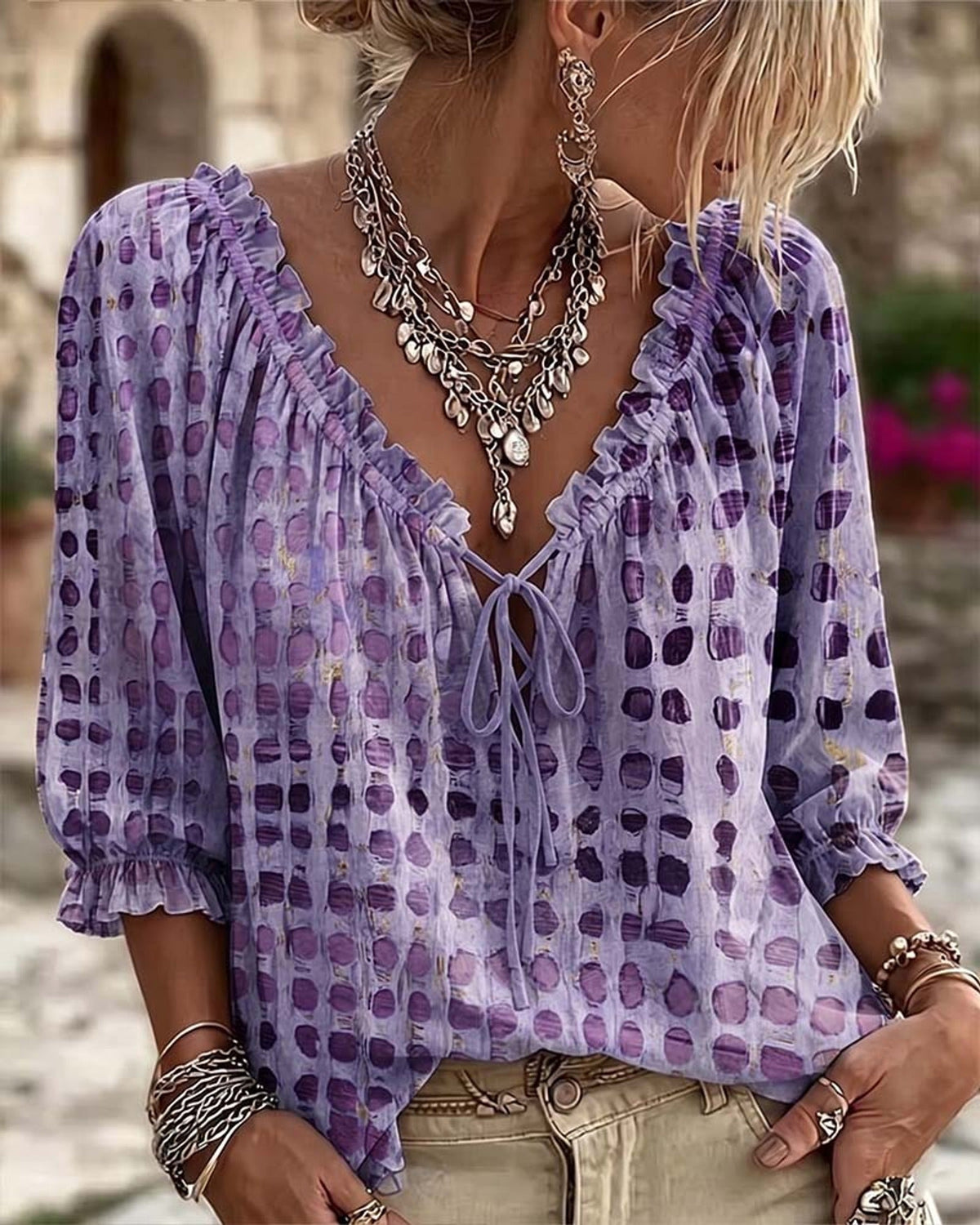Mist blue Xylia blouse captured in motion, showing its light and flowing drape beautifully.