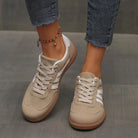 Woman wearing wine red Elara orthopaedic cushioned trainers, styled with casual attire for a comfortable everyday outfit.