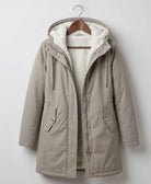 Detail of the Elara parka's pocket, emphasizing its practical design for keeping essentials dry.
