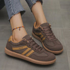 Side view of a khaki Elara orthopaedic cushioned trainer, highlighting its earthy tone and robust construction.
