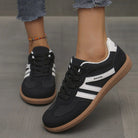 Frontal view of the off-white Elara orthopaedic cushioned trainer, highlighting the breathable mesh and lace-up detail.