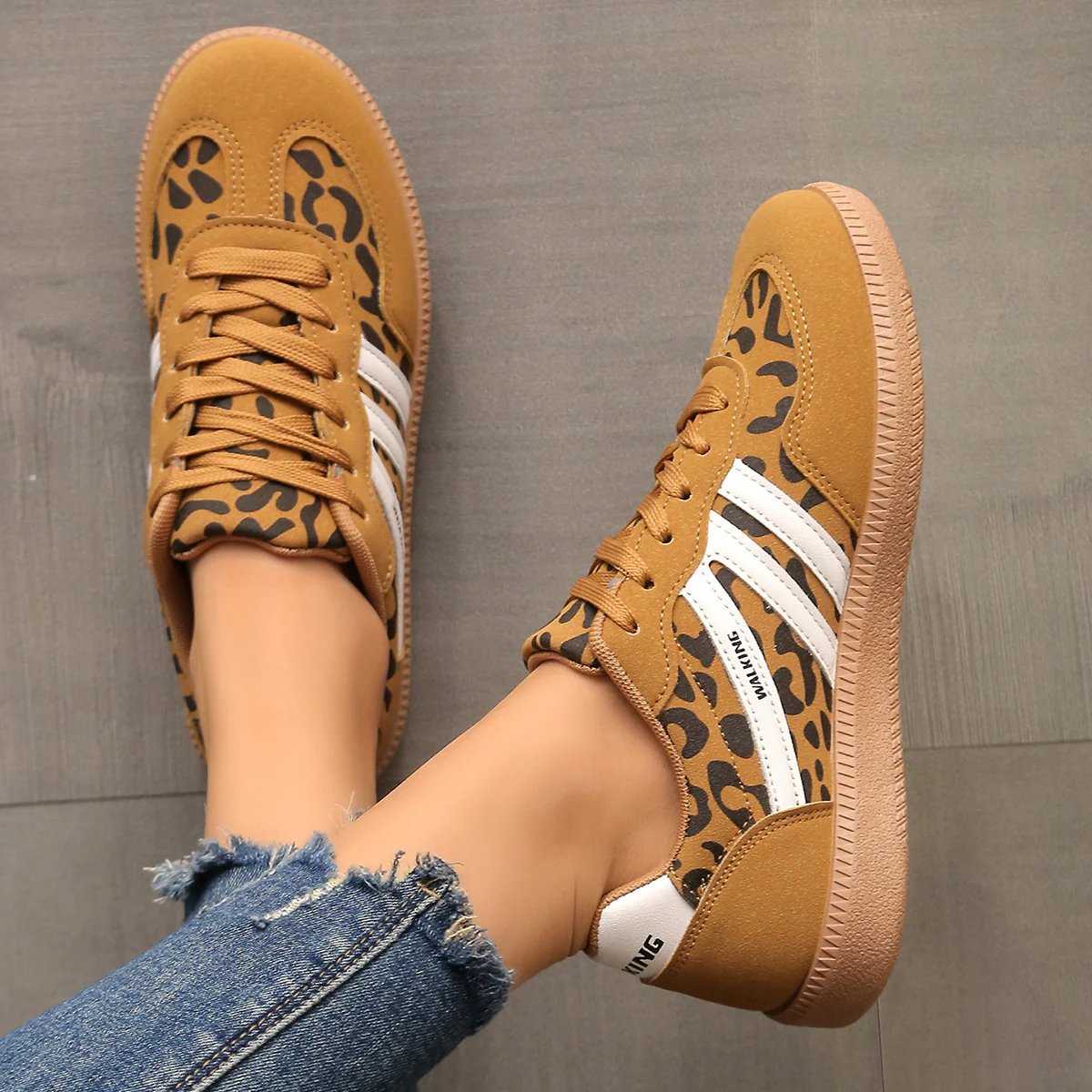 Pair of brown Elara orthopaedic cushioned trainers, presented from above, emphasizing their warm color and stylish versatility.