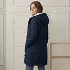 Close-up of the Elara parka's waterproof outer fabric texture, demonstrating its robust rain protection.