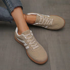 Top-down perspective of the off-white Elara orthopaedic cushioned trainer, showing the foot opening and interior cushioning.