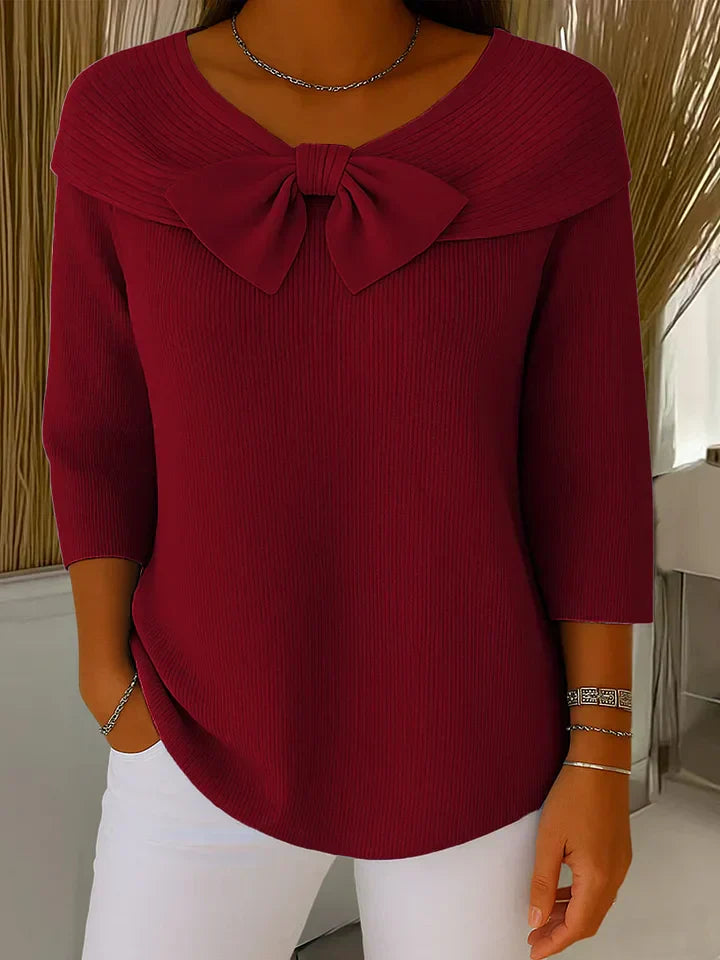 Back view of the khaki elegant knitted top, emphasizing the garment's overall drape and seamless design.