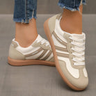 Detail of the breathable mesh upper on an off-white Elara orthopaedic cushioned trainer, indicating ventilation features.