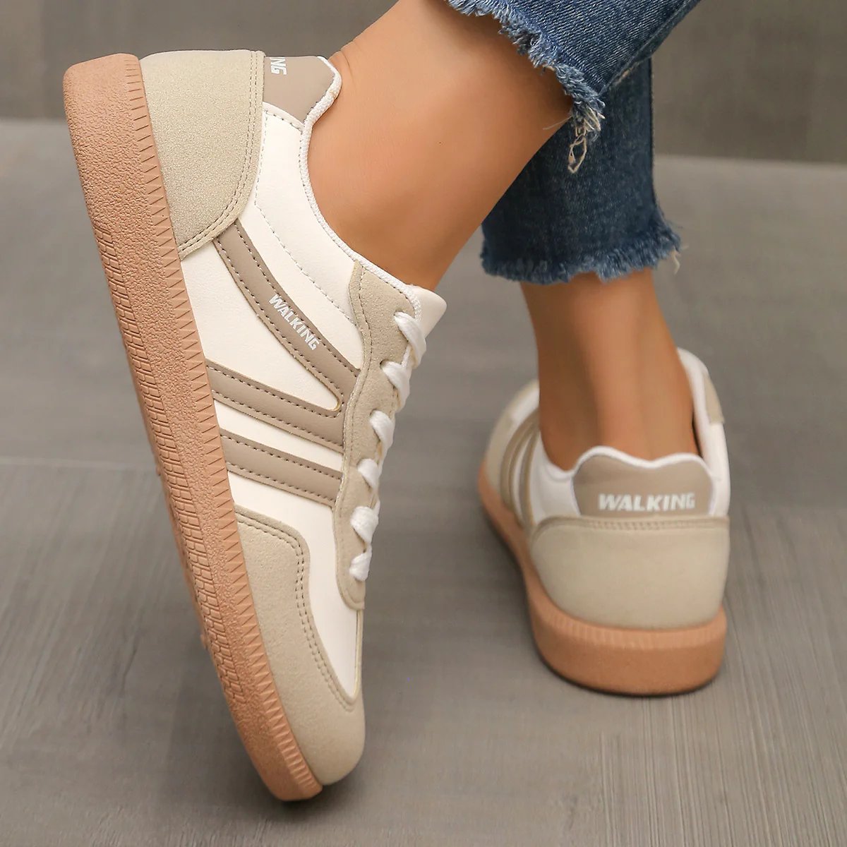 Side view of a black Elara orthopaedic cushioned trainer, highlighting its streamlined silhouette and supportive heel.