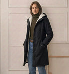 A model zipping up the Elara parka, illustrating the smooth operation of the wind-blocking closure.