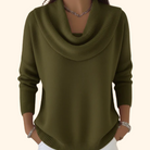 Model wearing Elina comfort fit pants in a vibrant green, styled casually with a white top.