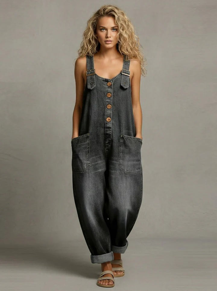 The Suri chic utility jumpsuit laid flat, showing the adjustable straps and fabric texture.
