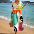 Front view of the Esmée abstract print midi dress, showcasing its vibrant pattern and relaxed, flowing silhouette.