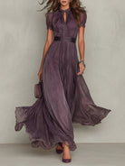 Front view of the Evadne purple chiffon lace maxi dress, showcasing the keyhole neckline and flowing skirt.