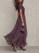 Close-up detail of the delicate lace trim on the sleeve and neckline of the purple chiffon maxi dress.