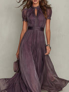 Back view of the purple chiffon lace maxi dress, showing the subtle closure and the luxurious flow of the fabric.