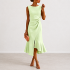 Textural detail of the fabric used in the draped midi dress, highlighting its quality and soft drape.