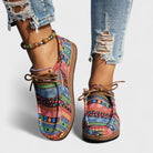 Pair of green Evora lightweight orthopedic sneakers styled casually with jeans for a comfortable look.