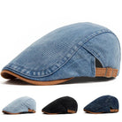 Front view of a dark blue denim flat cap, showcasing its classic shape and premium denim texture.