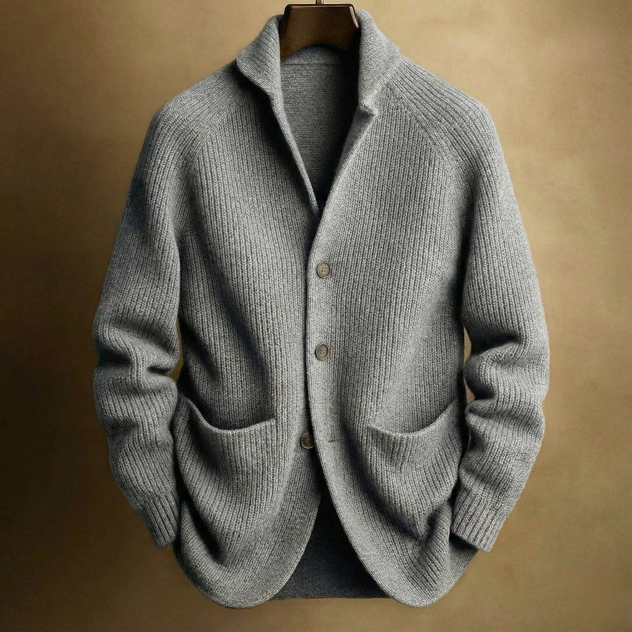 Hand in the front patch pocket of the Florian cardigan, demonstrating the practicality and size of the pockets.