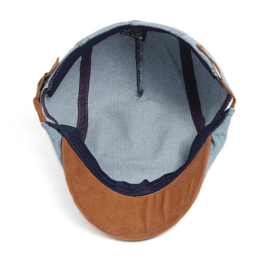 Lifestyle image of the denim flat cap paired with a smart-casual outfit, adding a touch of sophistication.