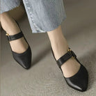 Close-up detail of the smooth brown leather upper on a slingback heel, showcasing its fine texture.