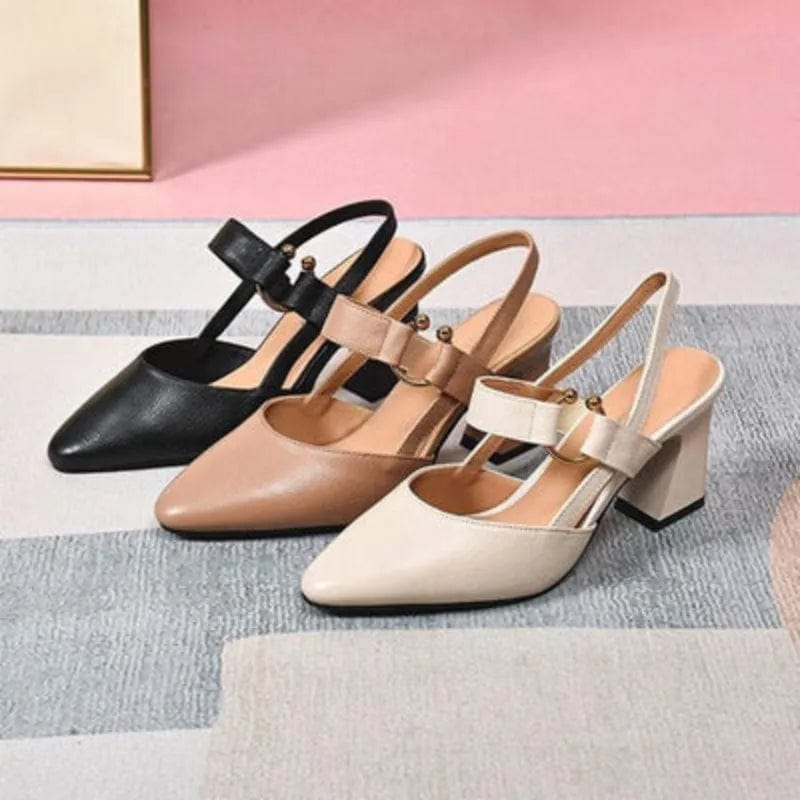 Rear angle of beige leather slingback heels, showing the secure and stable fit of the strap.