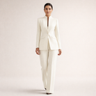 Close-up of the waistband and subtle flap pocket detail on elegant tailored pants.