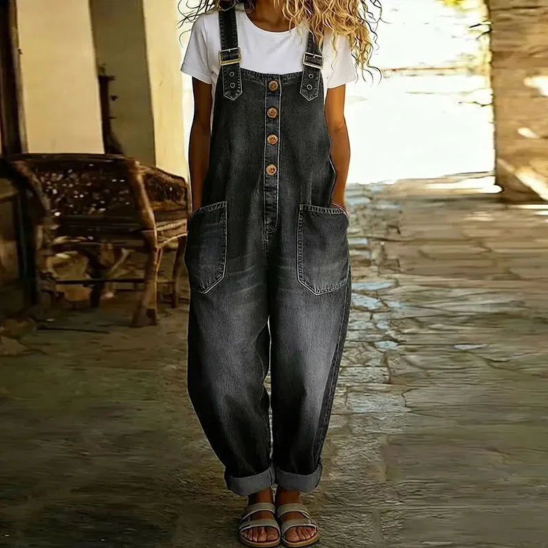 Back view of the black Hadley soft denim overalls, emphasizing the strap design and overall comfortable fit.
