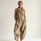Model wearing the khaki sleeveless jumpsuit in a casual outdoor setting, demonstrating its comfort.
