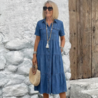 Lifestyle shot of a woman in the navy blue midi dress, demonstrating its effortless movement and versatile style.