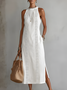Full-length front view of the Eleni breathable midi dress in white, showcasing its loose fit and elegant Mao collar.