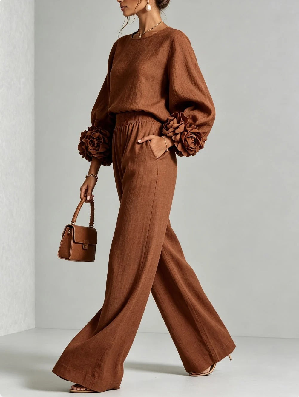 Outfit pairing suggestion with black wide-leg trousers, styled for a chic evening gathering.