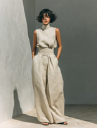 Back view of the flowing wide-leg trousers, emphasizing their comfortable and sophisticated design.