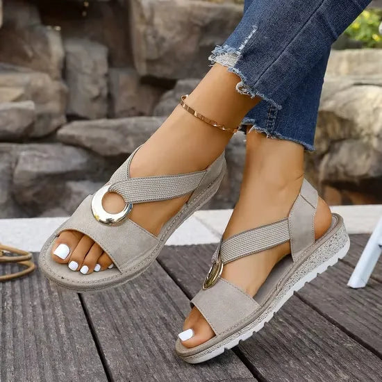 Artemis sandals in khaki, blue, black and beige.