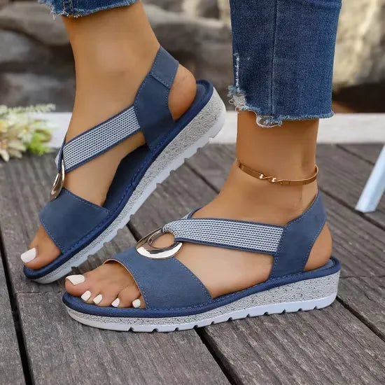 Pair of Artemis supportive cross-strap sandals in blue.