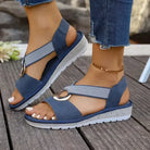 Pair of Artemis supportive cross-strap sandals in blue.