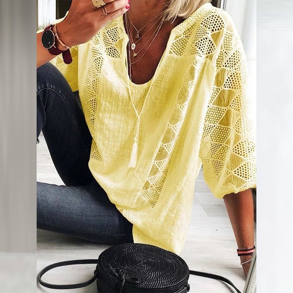 Back view of the breezy white blouse, showing the loose silhouette and overall relaxed design perfect for movement.