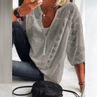 Model styled in the versatile cotton blouse with jeans, demonstrating its comfortable, everyday appeal and easy pairing.