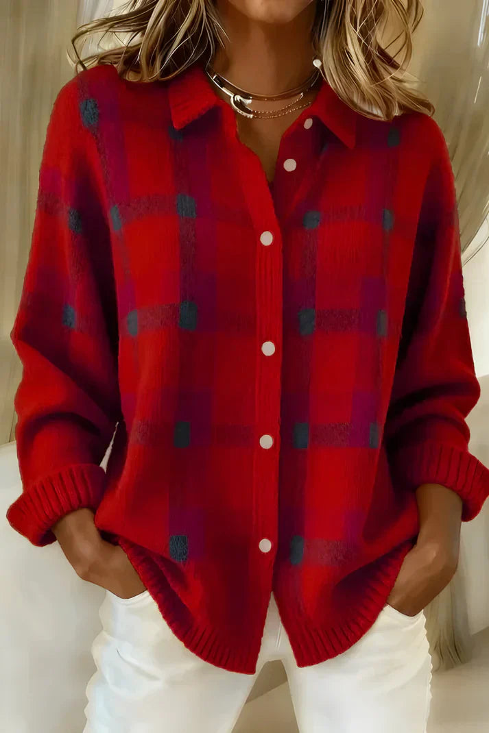 Side profile of the orange Inez button-up cardigan, highlighting the loose fit and button detailing.