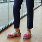 Side profile of the Inez artistic slip-on shoes, showcasing the vibrant pattern and sole design.