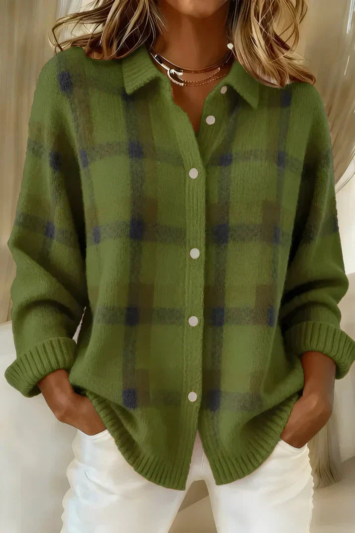 Close-up of the fabric texture and button closure on the orange Inez button-up cardigan.