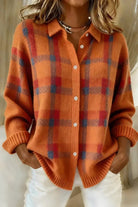 Back view of the Inez button-up cardigan in red, emphasizing its natural drape and overall silhouette.