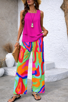 Kalia wide-leg pants featuring a vibrant abstract print, styled for a relaxed and comfortable silhouette.