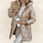 Front view of a beige Kiera hooded winter jacket with zipper and pockets.
