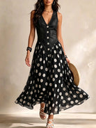 Close-up of the polka dot chiffon fabric on the skirt of the elegant denim chiffon dress, showing its delicate pattern.