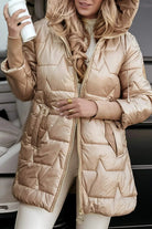 Overhead view of a grey Kiera hooded winter jacket laid flat to show its quilting.