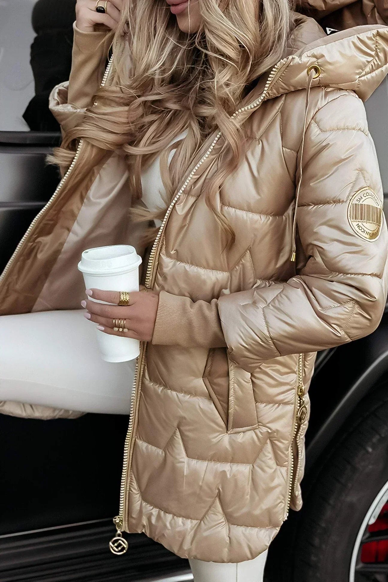 A pink Kiera hooded winter jacket styled with winter accessories.