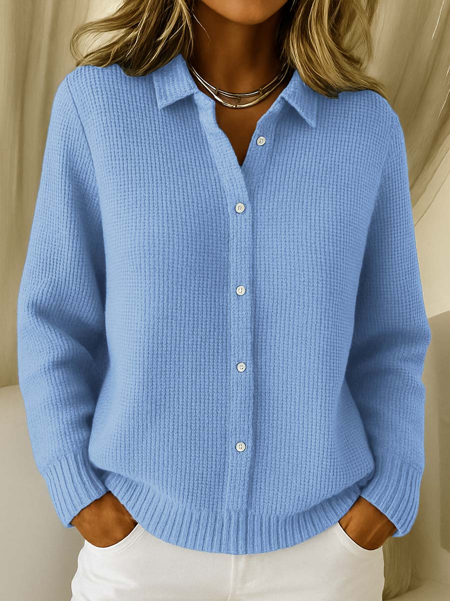 Lila elegant knit cardigan in blue, front view, draped loosely on a mannequin.