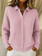 Woman wearing the Lila knit cardigan in pink, styled casually outdoors.