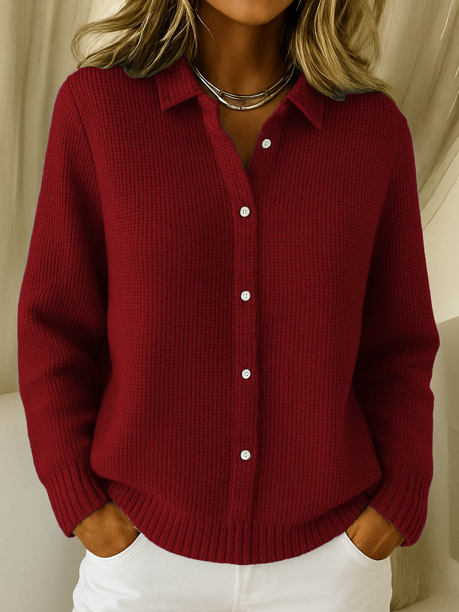 Lila elegant knit cardigan in navy, showcasing the classic collar and long sleeves.